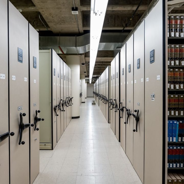 Compact rolling shelving in a modern archive storage room